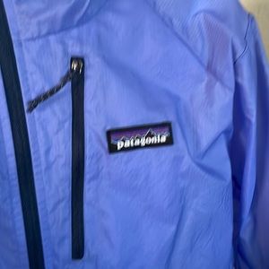 Patagonia wind breaker with hood.